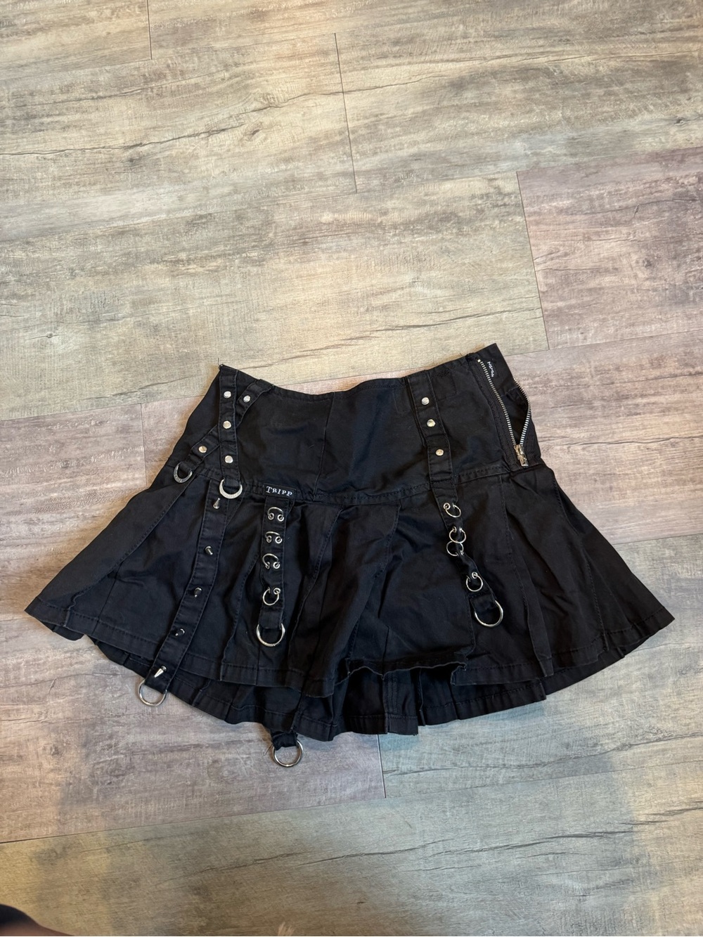 Tripp NYC Pleated Mini Skirt with Ring & Strap Details - Picture 2 of 3